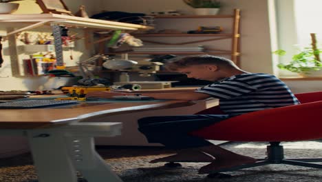 boy building with toys in his room