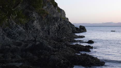 Sunset-Majesty:-Rocky-point-with-the-sun-setting-over-distant-mountains