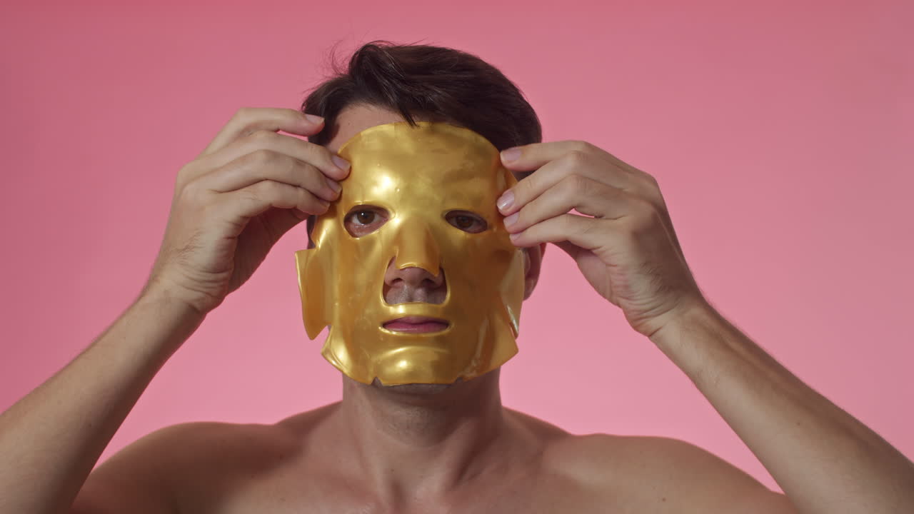 Adult Man Using Hydrogel Sheet Mask on Face