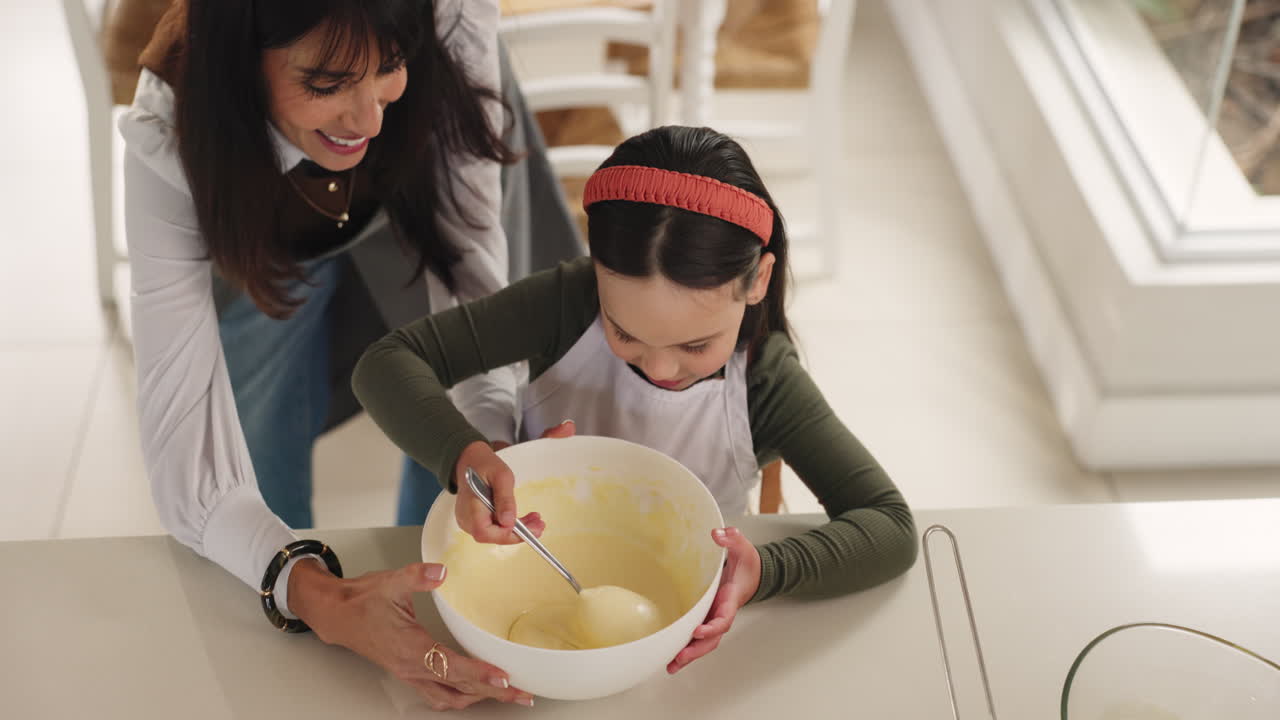 Child and woman baking together