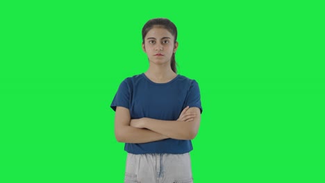 Confident-Indian-teenage-girl-standing-crossed-hands-Green-screen