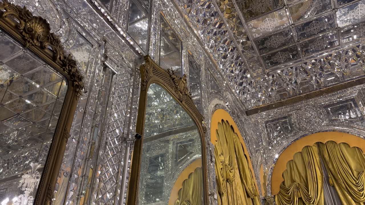 Persian mirrorwork interior design architecture with stunning pattern of geometric origami style decorative mosaic light reflection shining luxury mansion hall ceiling wall artisan design Tehran Iran