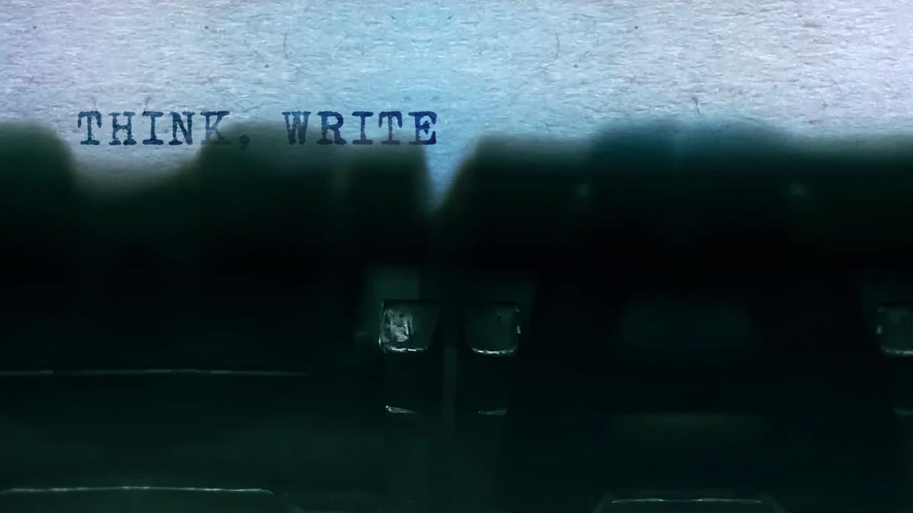 Think write create word closeup being typing and centered on a sheet of paper on old vintage