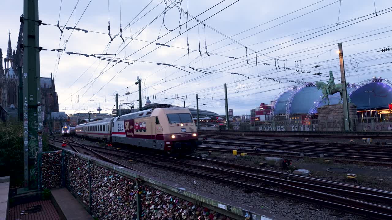 Trains passing over bridge near Cologne Cathedral