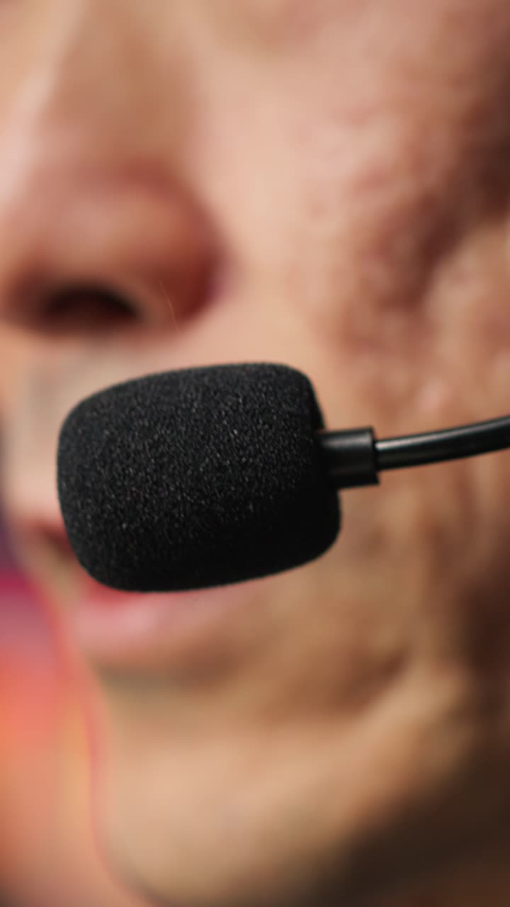 Vertical video Closeup of IT support specialist in call center office doing troubleshooting