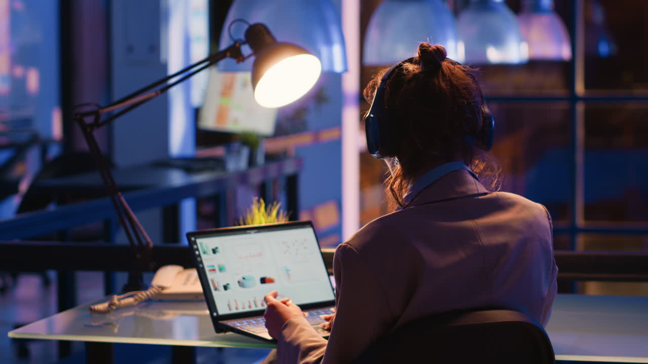 Woman working on laptop in office