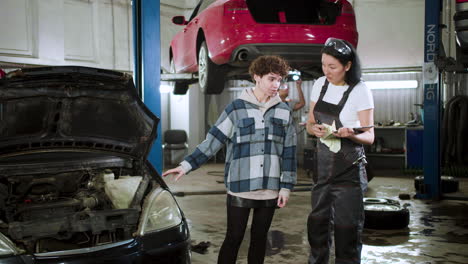 mechanic talking with client