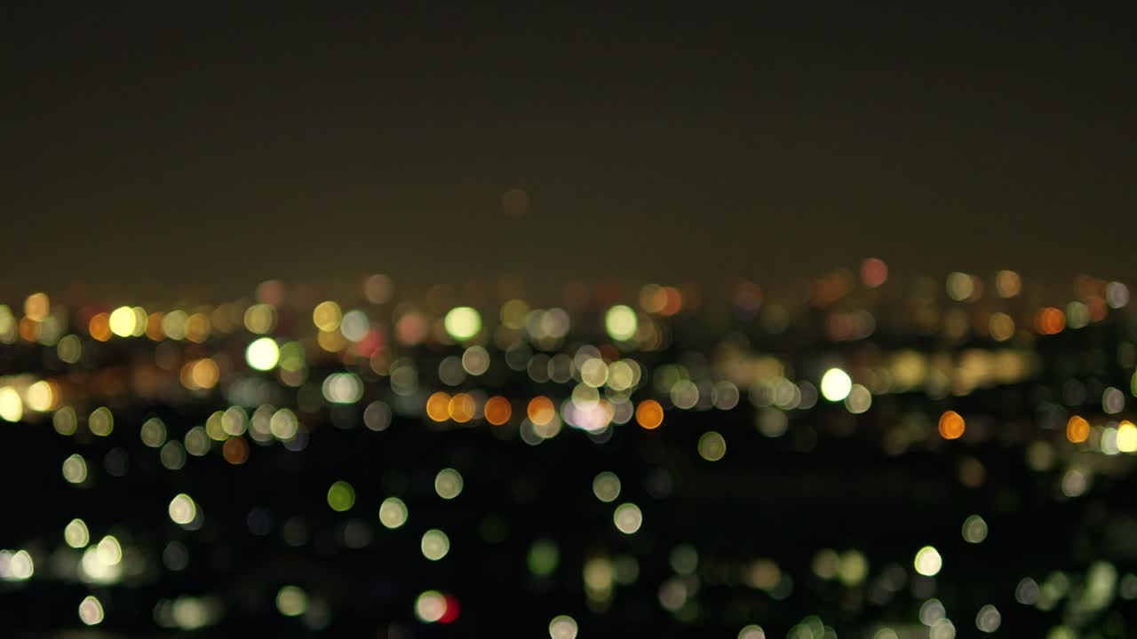 A captivating display of city lights at night showcasing an urban landscape filled with vibrant colors