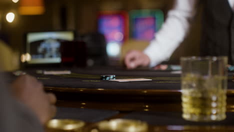 man looking at his hand of cards.