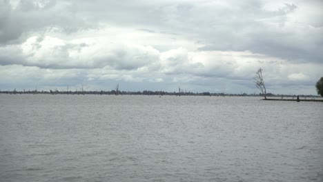 Static-shot-of-lake-on-windy-cloudy-day