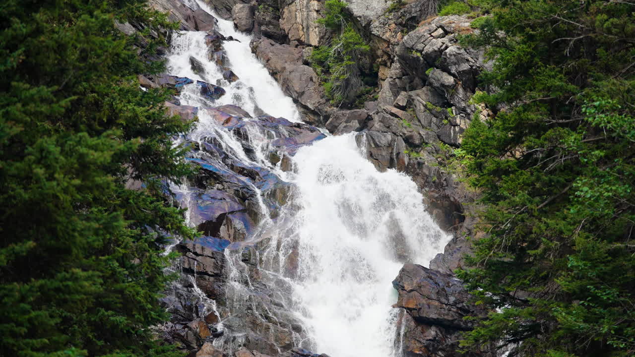 Majestic Waterfall Cascading Down Rocky Terrain