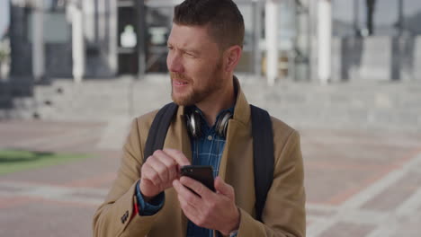 portrait-young-businessman-using-smartphone-texting-browsing-online-messages-looking-around-distracted-urban-male-professional-on-mobile-phone-in-city