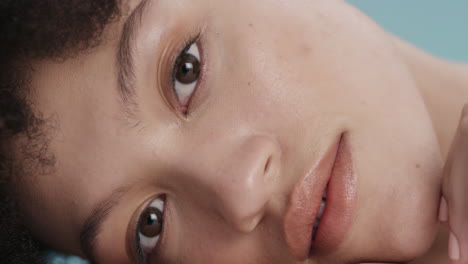 close up portrait beautiful mixed race woman touching face with hand caressing smooth healthy skin complexion enjoying perfect natural skincare gorgeous feminine beauty concept