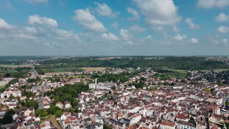 Aerial-view-of-the-center-of-Coulommiers,-France,-featuring-charming-architecture-and-surrounding-greenery