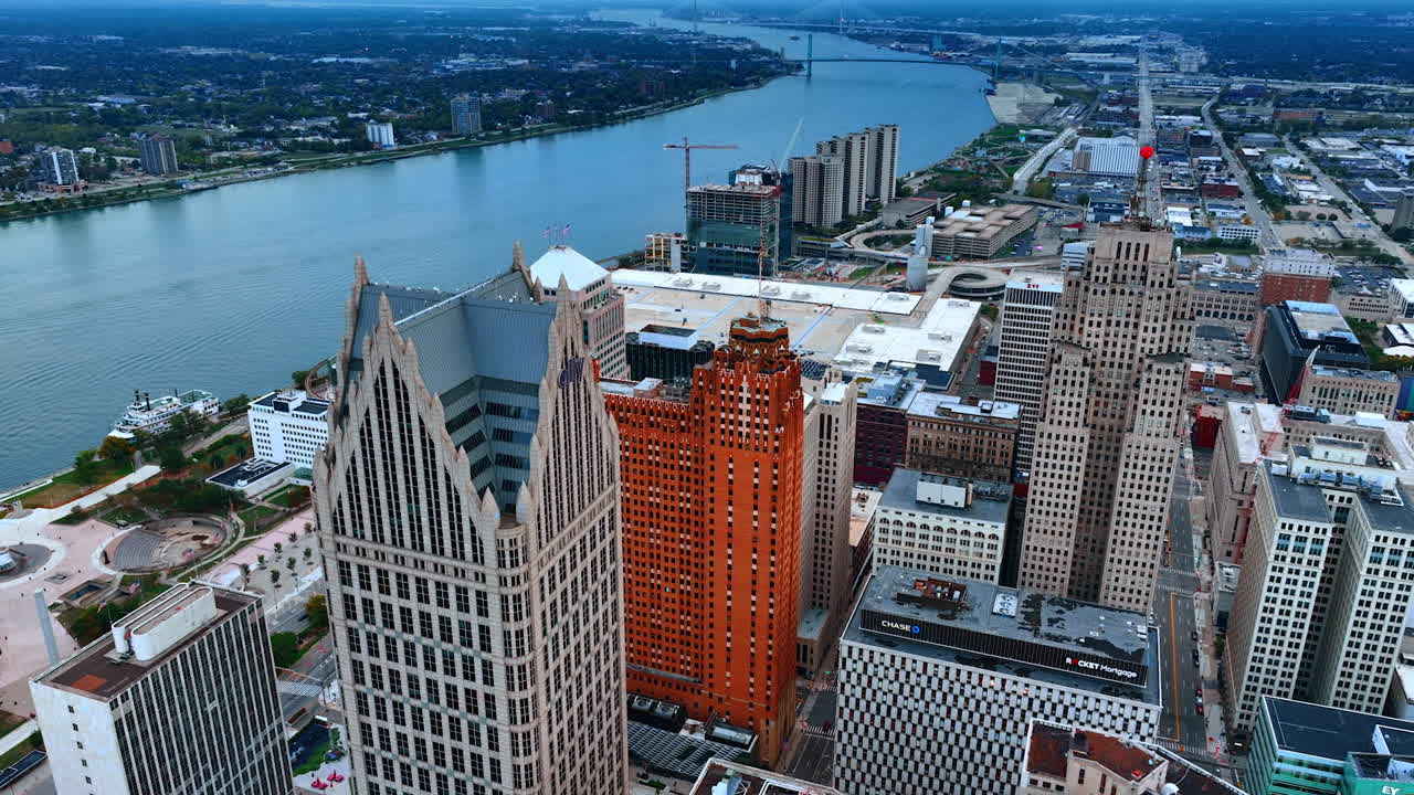 Detroit, USA, 11 August 2025: Stunning sunset over Detroit riverfront. Renaissance Center reflects in the river under a colorful twilight sky