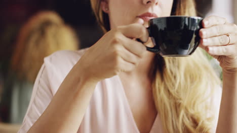 beautiful woman drinking coffee in cafe portrait