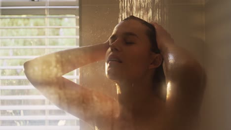 Woman-taking-a-shower-in-bathroom