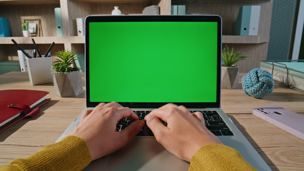 IT specialist working chroma key laptop at contemporary home office closeup