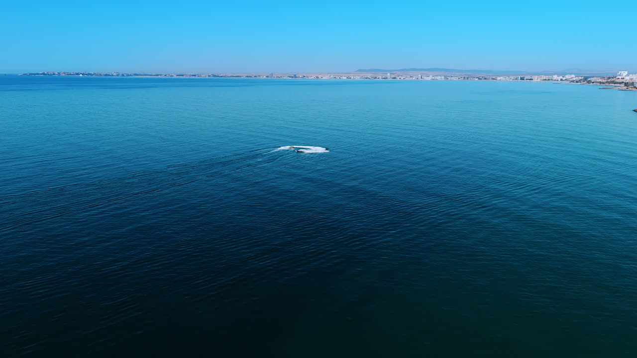 Yacht sailing in the open Black Sea near Bulgaria. Aerial drone view of a yacht sailing in the calm waters of the Black Sea near the Bulgarian coast