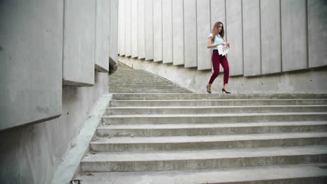 female manager walking down stairs