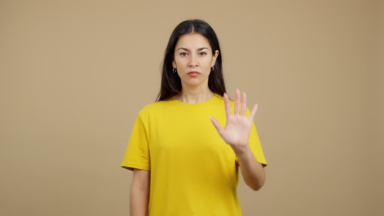 Woman gesturing stop with her hand