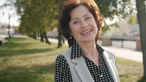 smiling senior woman in park