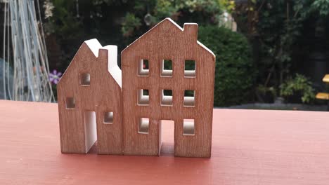 tiny wooden house ornament in garden mortgage concept idea