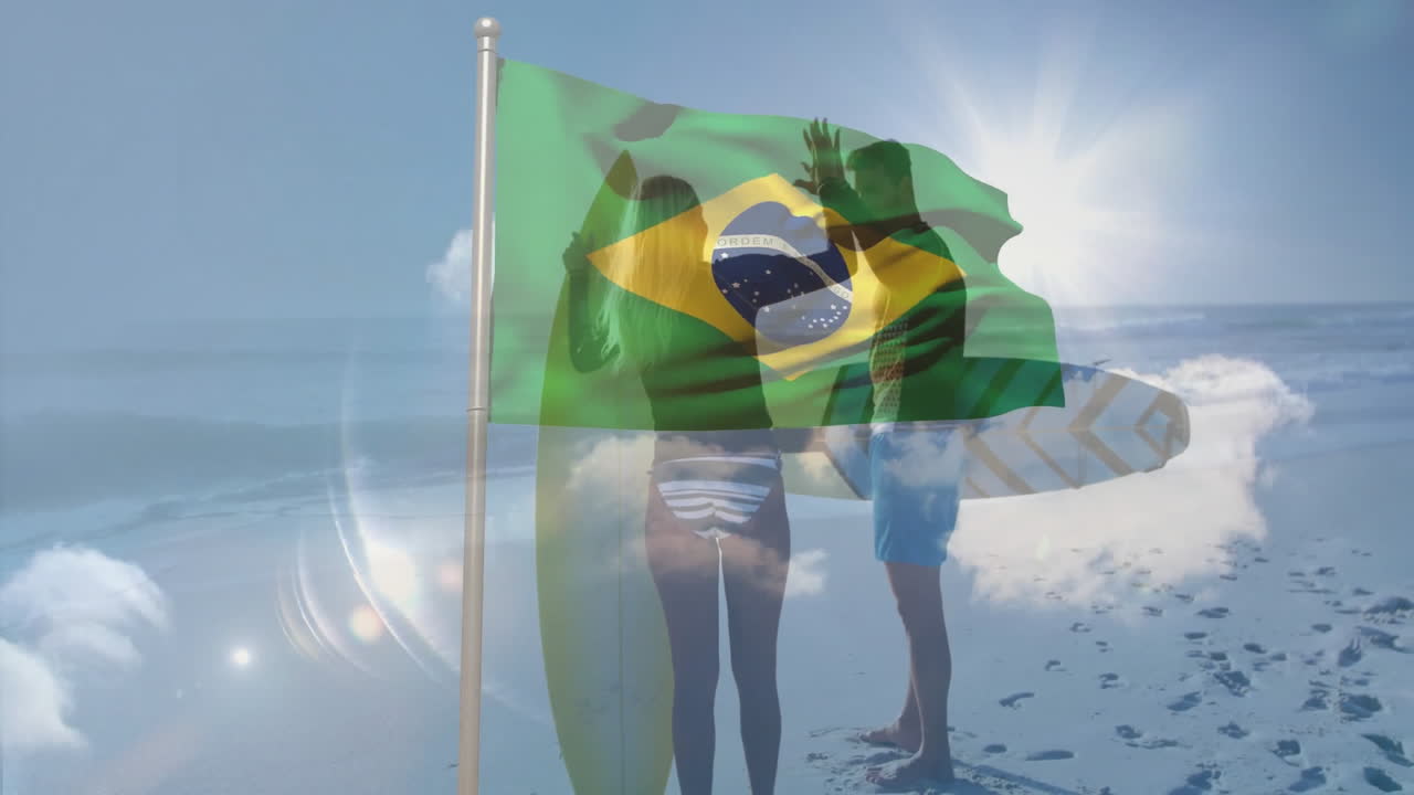 Waving Brazilian flag over surfers silhouetted on sunny beach with animation
