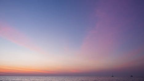 abstract colorful twilight sky. pink pastel panoramic view at seacoast in thailand. clouds moving slowly in the wide space. romantic color of sunset overseas. nature light footage b-roll timelapse