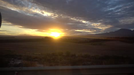 slowmotion shot of a nice sunset in africa, shot from a moving car