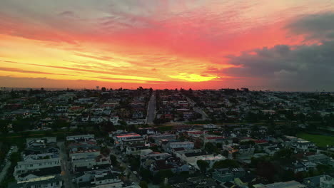 Aerial-view-circling-the-Manhattan-Beach-neighborhood,-dusk-in-Los-Angeles,-USA