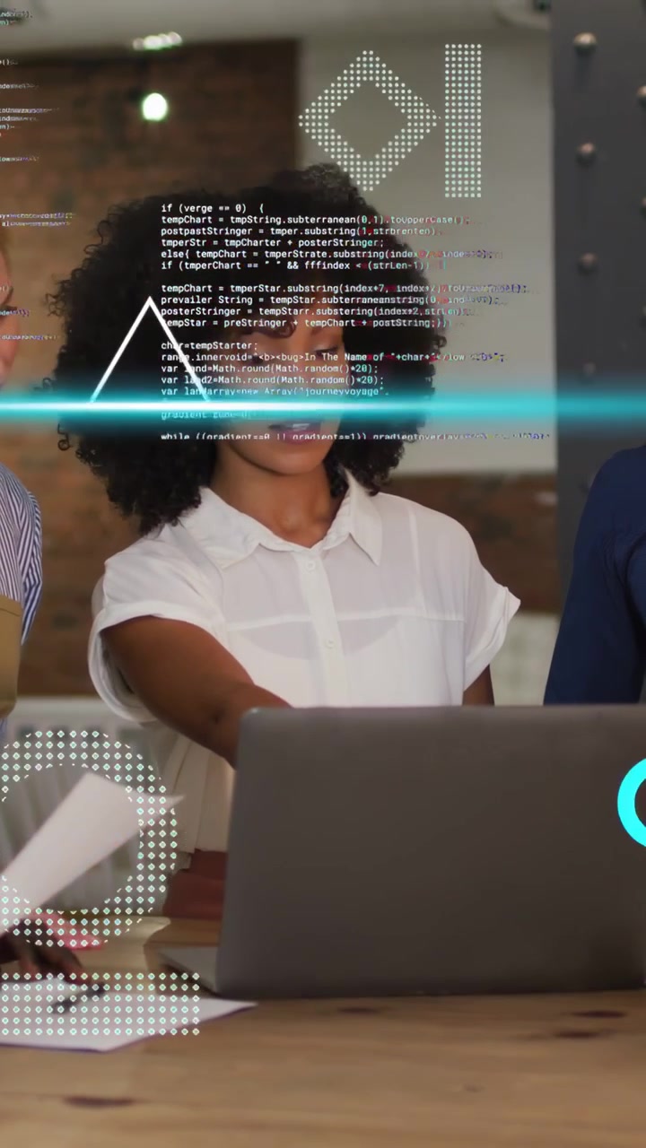 Vertical video: Woman reaching laptop peer passing docs starting HUD layering over table for tech