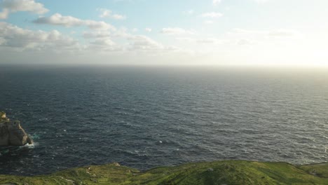 aerial: winter mediterranean sea with high waves hitting coastline in malta