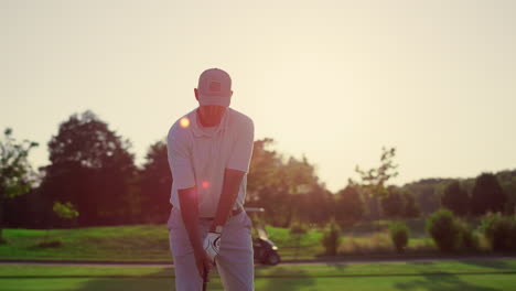 professional golfer hitting ball on fairway game. pensioner spend time outdoors.