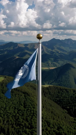 united nations flag on a mountain summit
