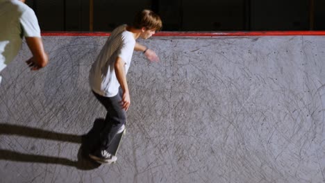 Male-friends-practicing-skateboarding-4k