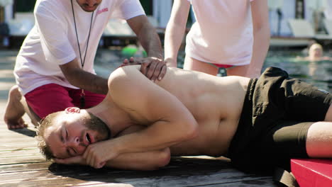 lifeguards rescuing a man