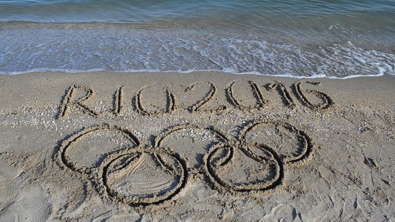 Rio 2016 an inscription on sand, the beach. Symbol Olympic game on sand, the beach
