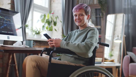 woman in wheelchair working from home