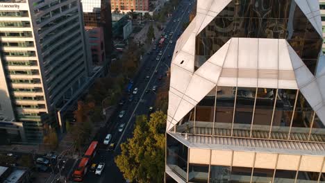 aerial drone shot of avenue next to art deco building