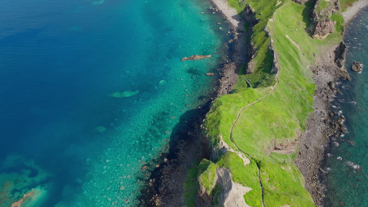 Aerial Establishing fly cape island landscape in Hokkaido, Japan blue sea, drone view, summer vibes