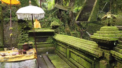 balinese temple architecture in pura mengening tampaksiring green stones altar for worshiping in water purification ritual bali landmark, melukat