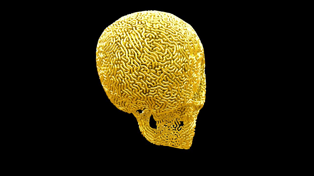 золотой вырезанный череп