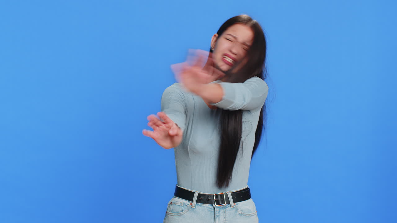 Annoyed irritated young woman covering ears gesturing no avoiding advice ignoring noise loud voices