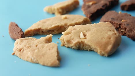 broken cookies on blue surface