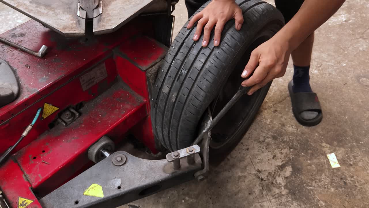 Changing a tire on a car lift
