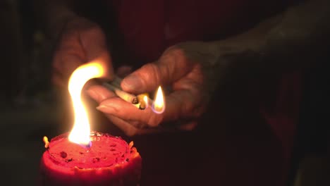 Close-up-hand-devotee-hold-joss-stick