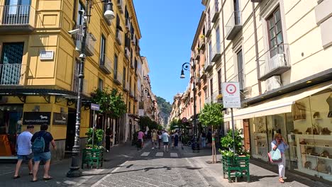 pedestrians walking along a vibrant street