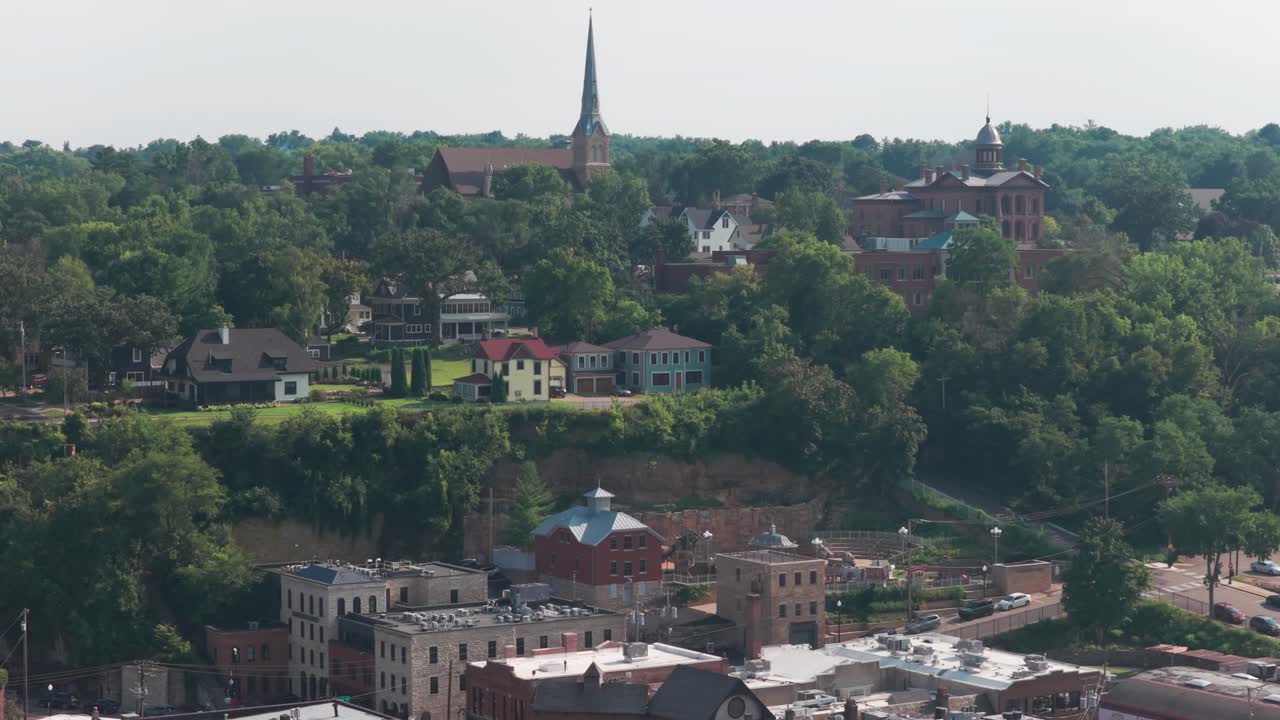 Aerial telephoto panning shot of the historic St. Michael's Catholic Church in charming Stillwater, Minnesota. 4K