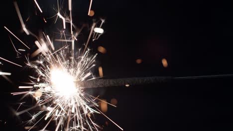 burning sparklers on a dark background